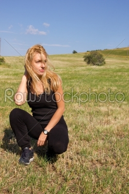 beautiful young blonde woman in the summer field