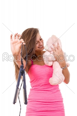 beautiful young woman refuses to grow up holding teddy bear