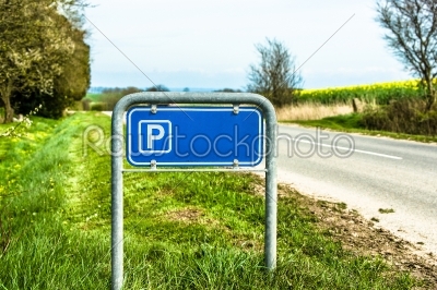 Blue parking sign in nature