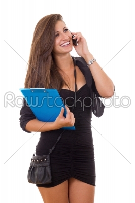 business woman carrying folder and purse talking on the phone