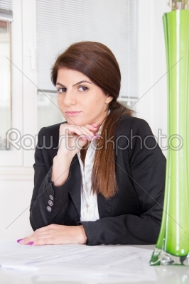 business woman sitting with hair tied in ponytail
