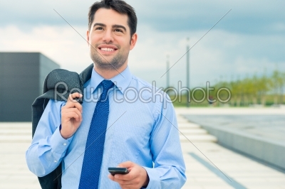 Businessman using phone on travel