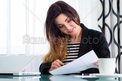 businesswoman in hotel working with agreement