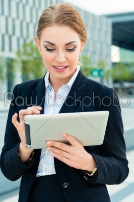Businesswoman using tablet computer 