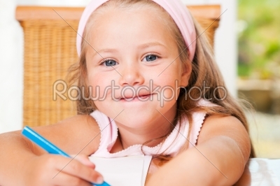 Child drawing something at home