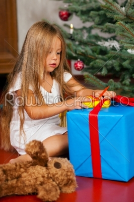 Child opening Christmas presents