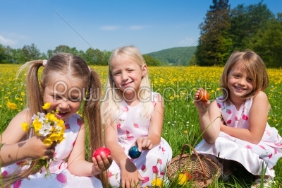 Children on Easter egg hunt with eggs