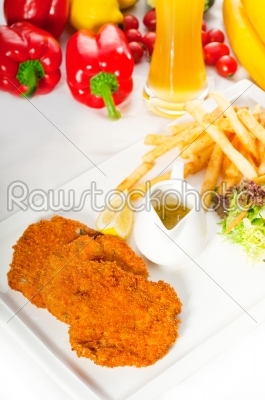 classic Milanese veal cutlets and vegetables