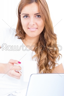 closeup portrait of woman holding cup of coffee with laptop