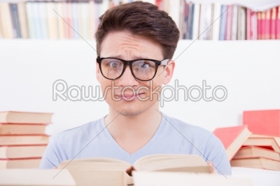 confused student surrounded by books
