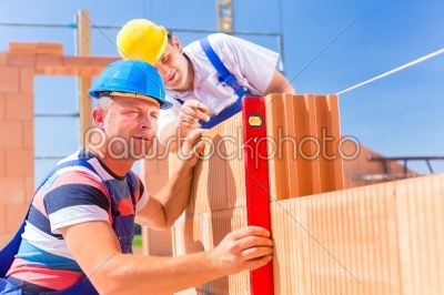 construction site workers checking  building shell