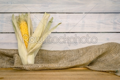Corn cob on a wooden table