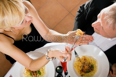 Couple eating pasta for dinner