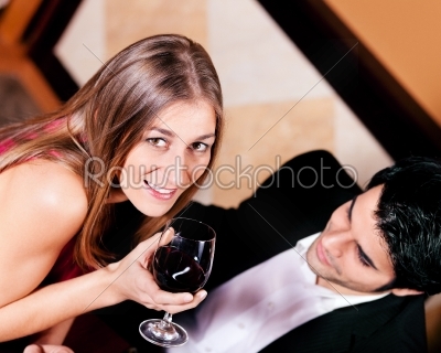 Couple having red wine in restaurant
