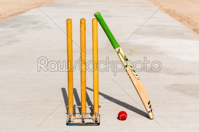 Cricket bat, ball and stumps
