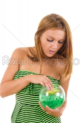 curious girl with glass bowl and flower inside