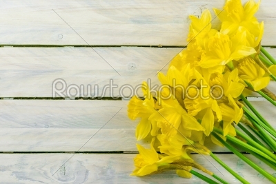 Daffodils flowers on wood