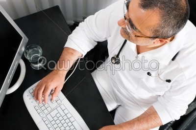 Doctor working at the PC