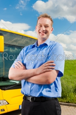 Driver in front of his bus