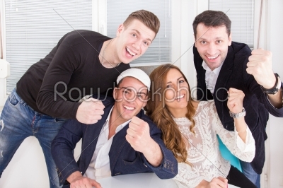 excited enthusiastic happy friends showing sign of success with 