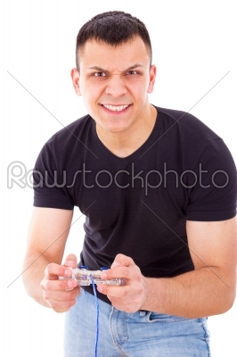excited young man playing playstation with joystick