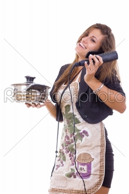 experienced business woman cooking and talking on the phone