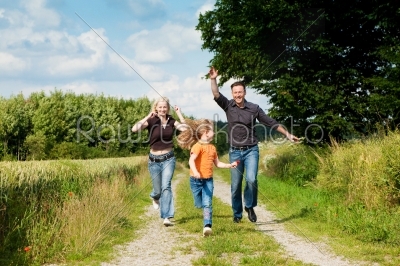 Family playing at a walk
