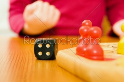 Family playing boardgame