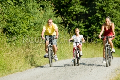 Family riding the bicycles together