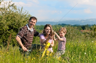 Family summer - playing on the meadow