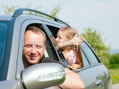 Family travelling by car