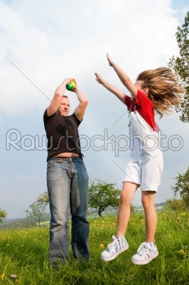 Father and daughter catching the ball