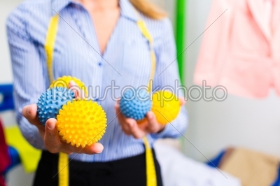 Female cleaner in laundry shop 