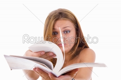 female student flipping a book