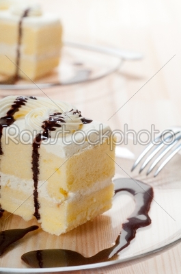 fresh cream cake closeup with chocolate sauce