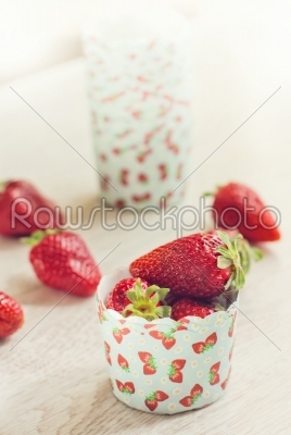 Fresh ripe strawberries on a paper case