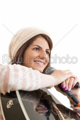 girl holding guitar and microphone