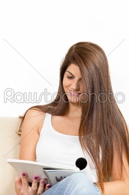 girl reading on the sofa and smiling