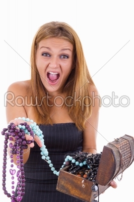 girl with face expression takes out jewelery from jewelry box