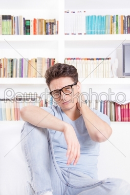 good looking man with glasses with neck pain