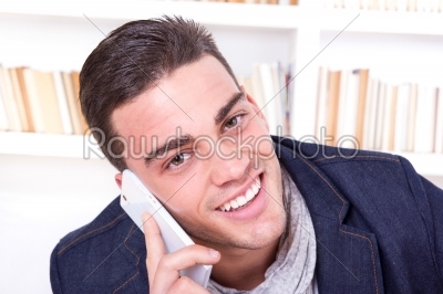 handsome sexy man talking on the phone smiling