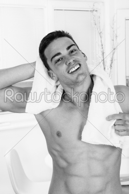 handsome sexy man with towel wrapped around neck