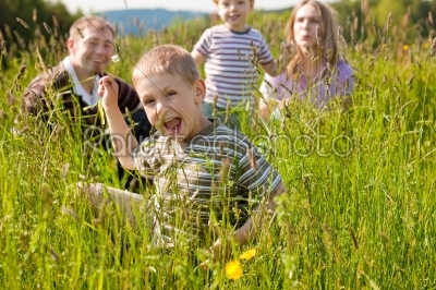 Happy family in summer outdoors