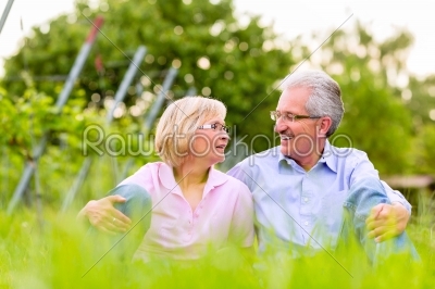 Happy senior man and woman in vineyard
