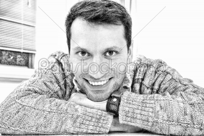 Horizontal closeup portrait of a handsome young man smiling