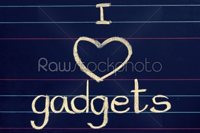 I Love gadgets phrase handwritten on blackboard