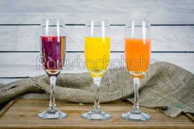 Juice variations on a wooden table