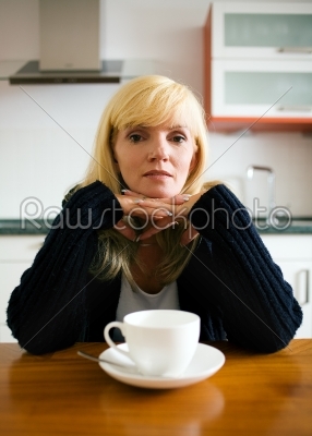 Lonely woman having breakfast
