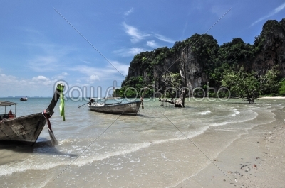 Long tail boat on tropical beach Railay Krabi Thailand