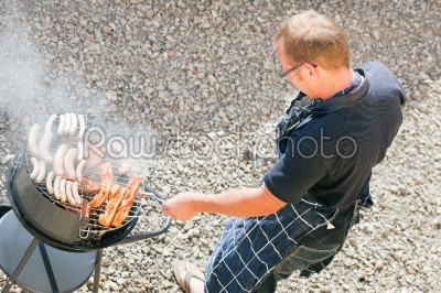 Man at the barbecue grill